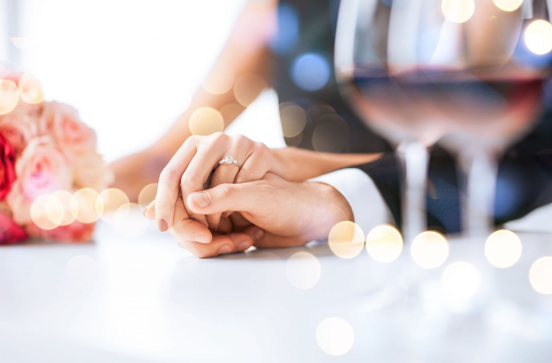 Couple engaged at holiday gathering